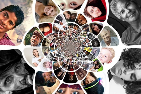 A spiral collage of diverse faces of people of all ages and backgrounds, arranged in a circular pattern.