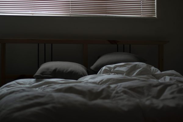bed in a dark room