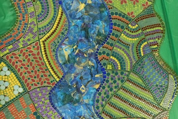 Colorful mosaic with a winding blue river, geometric patterns, flowers, and green, yellow, orange, and red tiles.