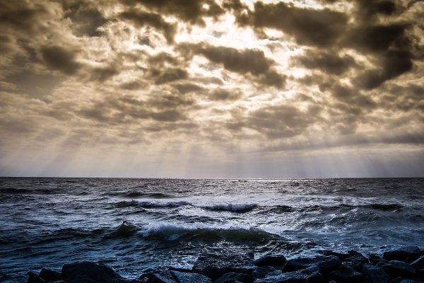 A cloudy sky over rocky shores