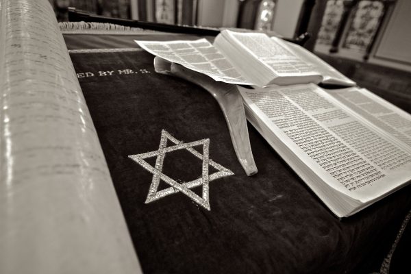 a prayer book on a lectern with a Star of David