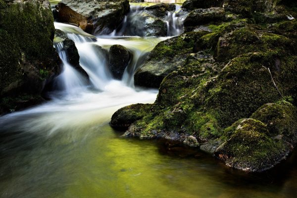 a stream falling over rocks