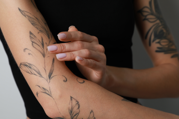 an arm covered with a tattoo