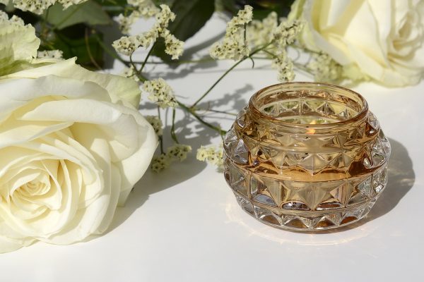 a white rose and tealight