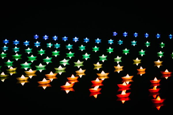 tiny-floating-boats-with-candles-in-rainbow-colors