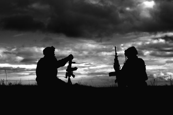 a black and white photo of two soldiers