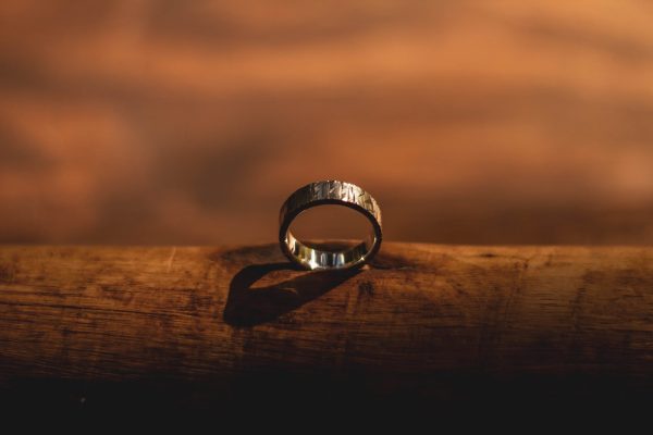 wedding band on a piece of wood
