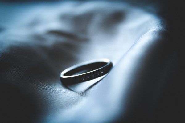 wedding band on black fabric