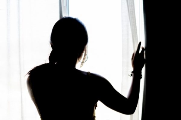 A woman's silhouette in the window