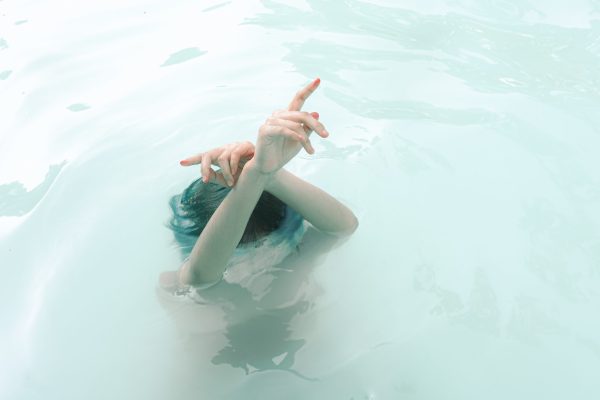 woman immersing under water